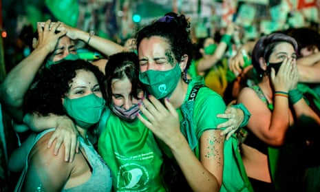 Pro-choice activists celebrate in Buenos Aires after politicians approved a bill to legalise abortion.