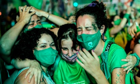 TOPSHOT-ARGENTINA-POLITICS-ABORTION<br>TOPSHOT - Pro-choice activists celebrate after the Senate approved a bill to legalize abortion outside the Congress in Buenos Aires on December 30, 2020. (Photo by RONALDO SCHEMIDT / AFP) (Photo by RONALDO SCHEMIDT/AFP via Getty Images)