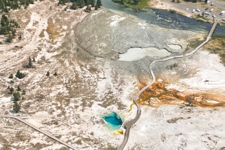 This aerial photo taken after the eruption shows the pool near the boardwalk enlarged compared to recent satellite images, and its water turned a muddy beige. The deep Sapphire Pool about 91m away retains its usual blue hues