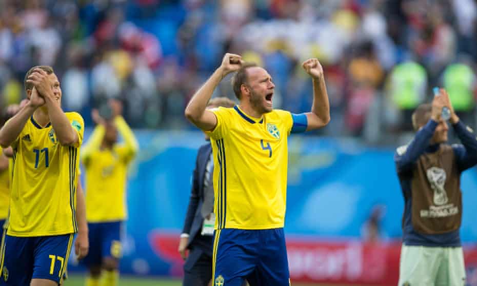 Andreas Granqvist (centre) celebrates inspiring Sweden to victory against Switzerland in the last 16.