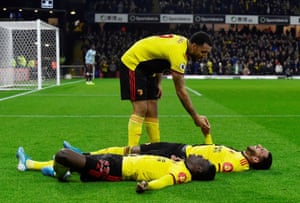 Troy Deeney lifts Étienne Capoue off the floor afetr Ismaïla Sarr (bottom) sealed vicyroy over Aston Villa by scoring the third goal.