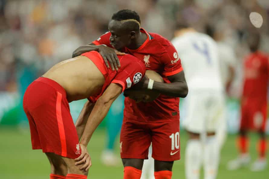 Liverpool’s Sadio Mane comforts Fabinho.