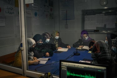A group of young women in a radio studio