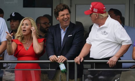 Tucker Carlson enjoying a laugh with Marjorie Taylor Greene and Trump in July 2022. 