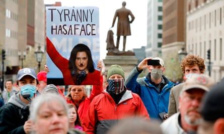 Demonstrators protest in Lansing, Michigan, on 14 May.