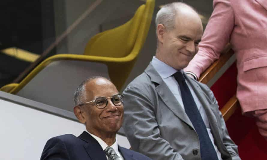 The outgoing executive editor, Dean Baquet, left, with his successor, Joe Kahn, in the New York Times newsroom last year.