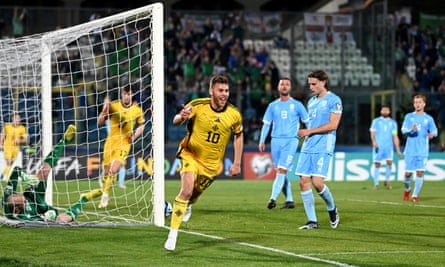 Dion Charles wheels away after opening the scoring for Northern Ireland in Serravalle, San Marino.