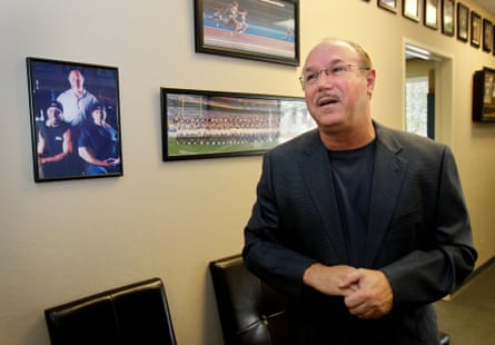 Victor Conte in 2012, next to a picture of himself with Barry Bonds and his coach Greg Anderson, and one of Marion Jones running