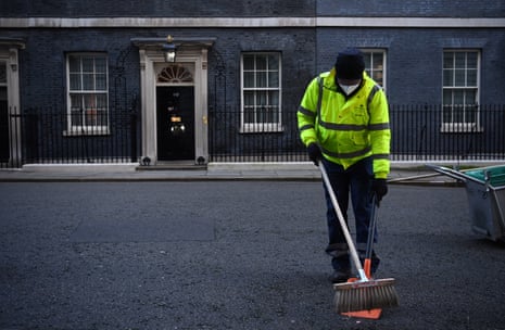 A cleaner sweeping in Downing Street this morning.