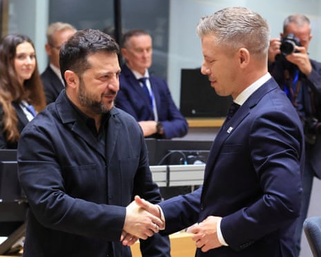 Volodymyr Zelenskyy and Péter Magyar shake hands ahead of an EU summit roundtable