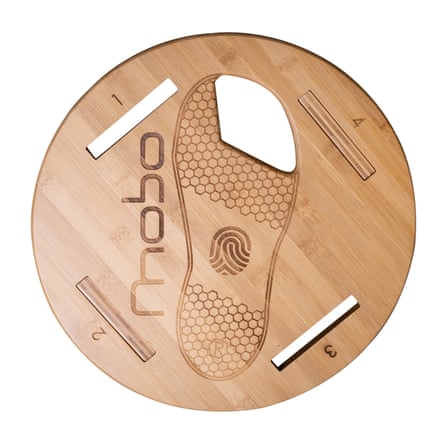 Round wooden balance board with footprint design