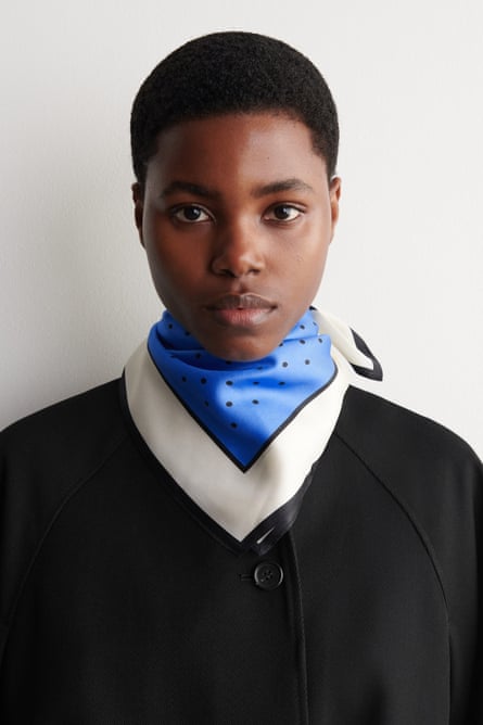 woman wearing black, white and blue neck scarf