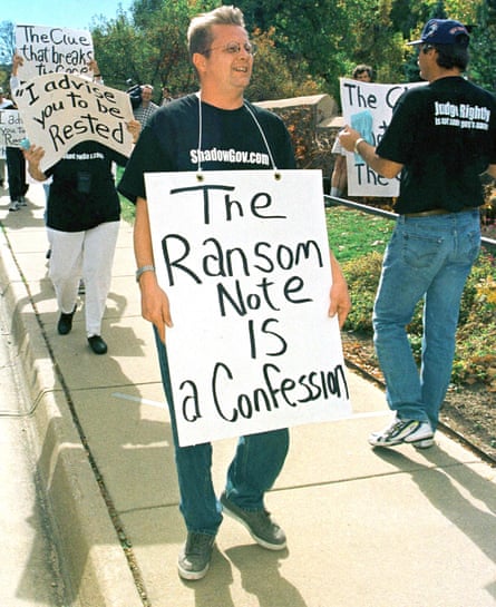 Protesters unhappy at the lack of a decision in the murder case march outside the justice centre in Boulder, Colorado, in 1999