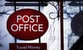 A red and white post office sign