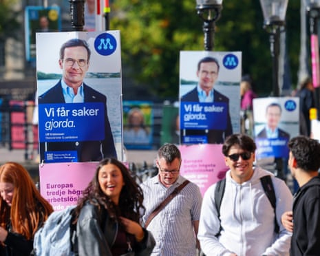 Posters featuring Swedish prime minister Ulf Kristersson of the Moderate Party is displayed near the Riksdag, Sweden's parliament.