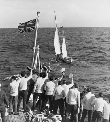A ship’s crew welcomes English sailor Robin Knox-Johnston on board his 32-foot (9.8-metre) boat Suhaili, as he nears Falmouth, 23 April 1969.