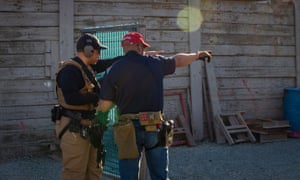 A veteran firearm instructor with the Black Gun Owners Association gives pointers during a drill at the Richmond Rod &amp; Gun Club.