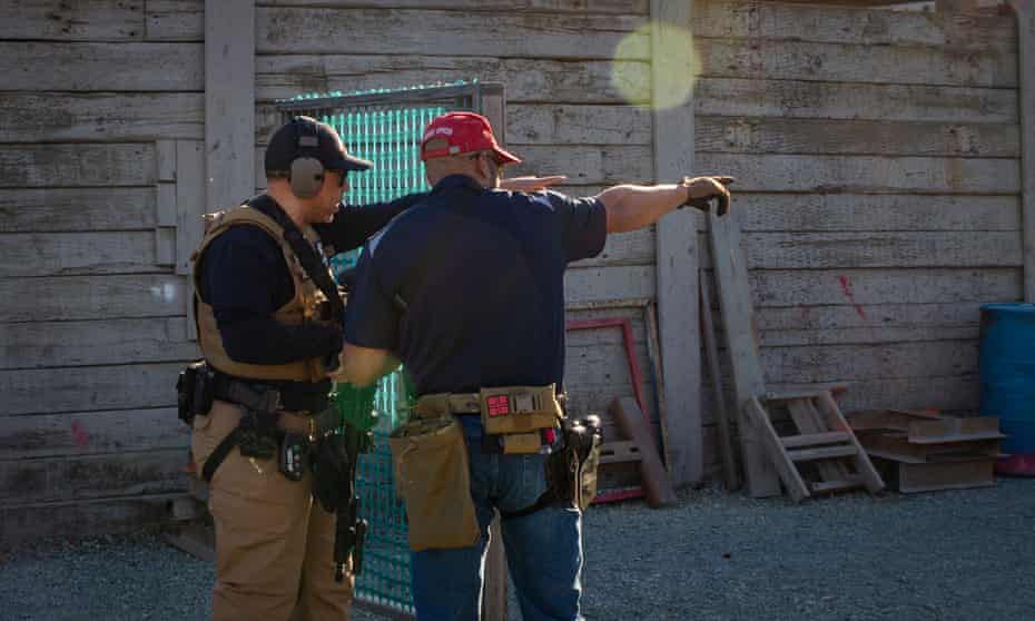 A veteran firearm instructor with the Black Gun Owners Association gives pointers during a drill at the Richmond Rod & Gun Club.