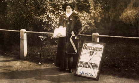 A woman holding out newspapers beside a placard with the headline 'Revolution'.