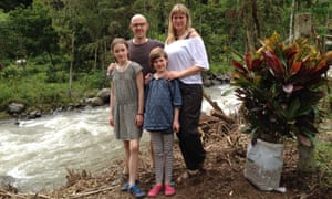Jo and Jamie Robins and family next to a fast-moving river.