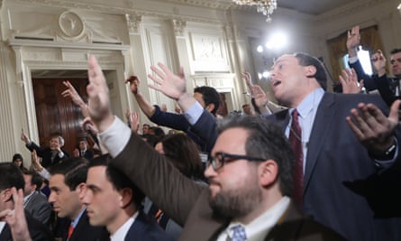 Reporters attempt to pose questions to Donald Trump during the press conference.