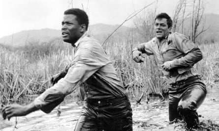 Sidney Poitier and Tony Curtis in The Defiant Ones, 1958. Both actors received Oscar nominations for their roles as convicts on the run.
