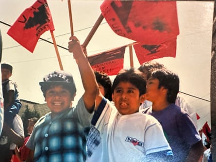 Children hold red flags