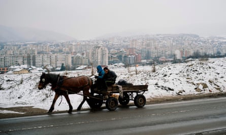 Men ride on a horse cart in the predominantly Roma suburb of Fakulteta on the outskirts of Sofia