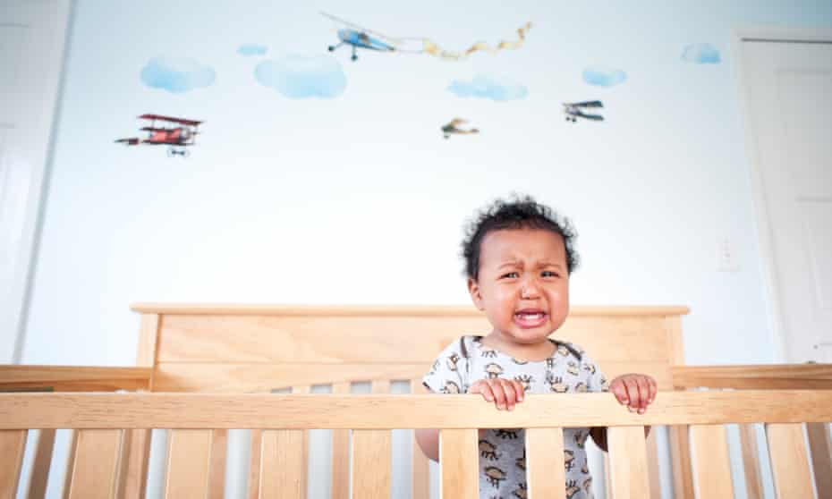 Standing toddler boy crying in his dot