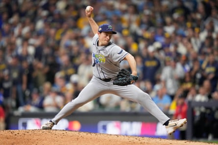 Tampa Bay reliever Kevin Kelly pitches during the seventh inning of Friday’s World Series opener against Milwaukee.