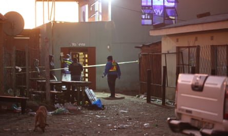 South African Police Forces (SAPS) and forensics experts work at the scene at the Enyobeni Tavern in East London, South Africa.