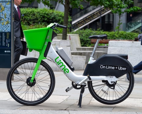 A Lime rental e-bike on the pavement in Leadenhall Street in London, United Kingdom