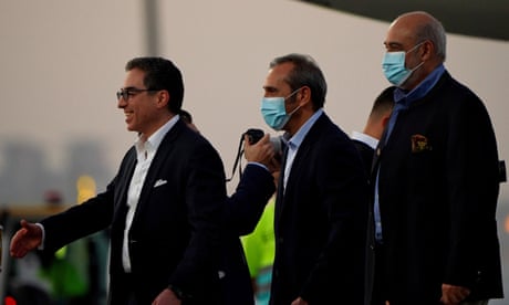 Siamak Namazi, Emad Sharghi and Morad Tahbaz walk away from a Qatar Airways flight that brought them out of Tehran and to Doha, Qatar.
