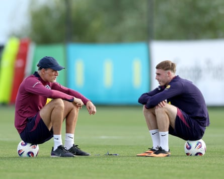 Cole Palmer chats with his England manager, Thomas Tuchel, in Catalonia.