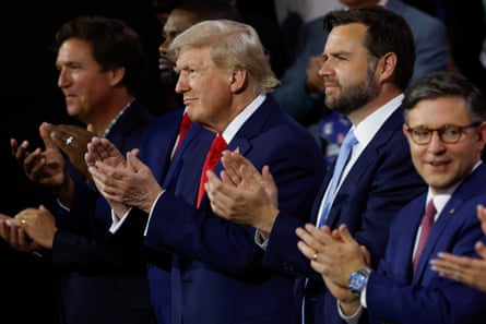 five men wearing blue suits clapping