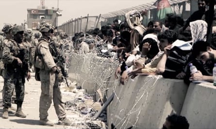 Soldiers guard the airport from desperate crowds.