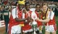 Arsenal's left-right, Kevin Campbell, Paul Davis, David Rocastle and Lee Dixon celebrate the League Championship win in May 1991.