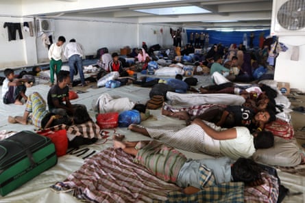 Rohingya refugees at their temporary shelter under the basement of a government building in Aceh.
