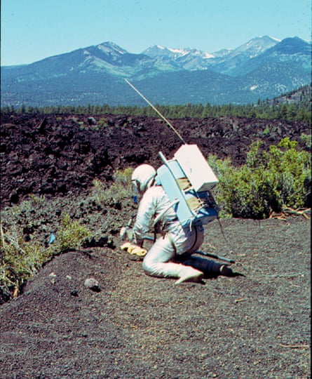 Collecting soil samples at Bonita Lava Flow near Sunset Crater Volcano national monument, June 1964. San Francisco Peaks are in the background.