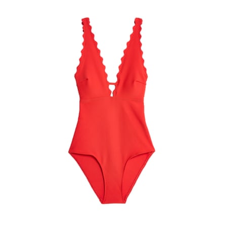 A tomato red Scallop trimmed swimsuit on a white background