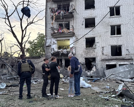 Police officers and residents stand at a site of an apartment building hit by a Russian missile strike, in the town of Borispil, Ukraine on 1 September , 2026.