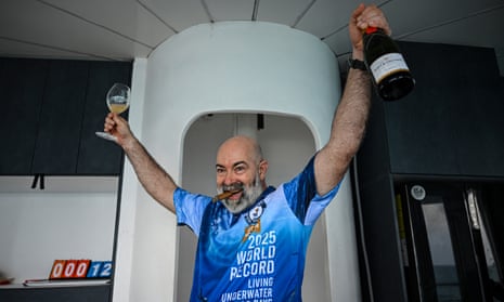 German aerospace engineer Rudiger Koch, 59, celebrates after breaking the Guinness world record for living in the ocean at a depth of eleven meters off the coast of Puerto Lindo, Panama, on 24 January, 2025.