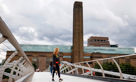 A woman looks at Tate Modern