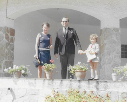 Joanne holds her father’s hand in a holiday photo from 1968.