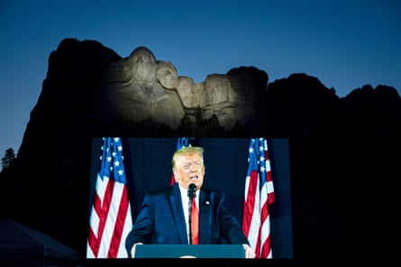 Donald Trump on a screen as he speaks during an event at Mount Rushmore National Memorial in Keystone, South Dakota, on 3 July 2020.