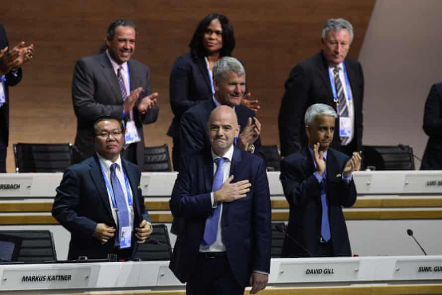 Infantino takes to the stage to a big round of applause.