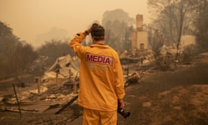 An ABC photographer Matt Roberts reacts to seeing his sister’s house destroyed by a bushfire in Quaama, NSW. The ABC plans to make its national head of emergency broadcasting redundant. 