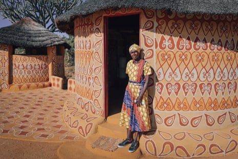 Jindi stands outside her decorated house