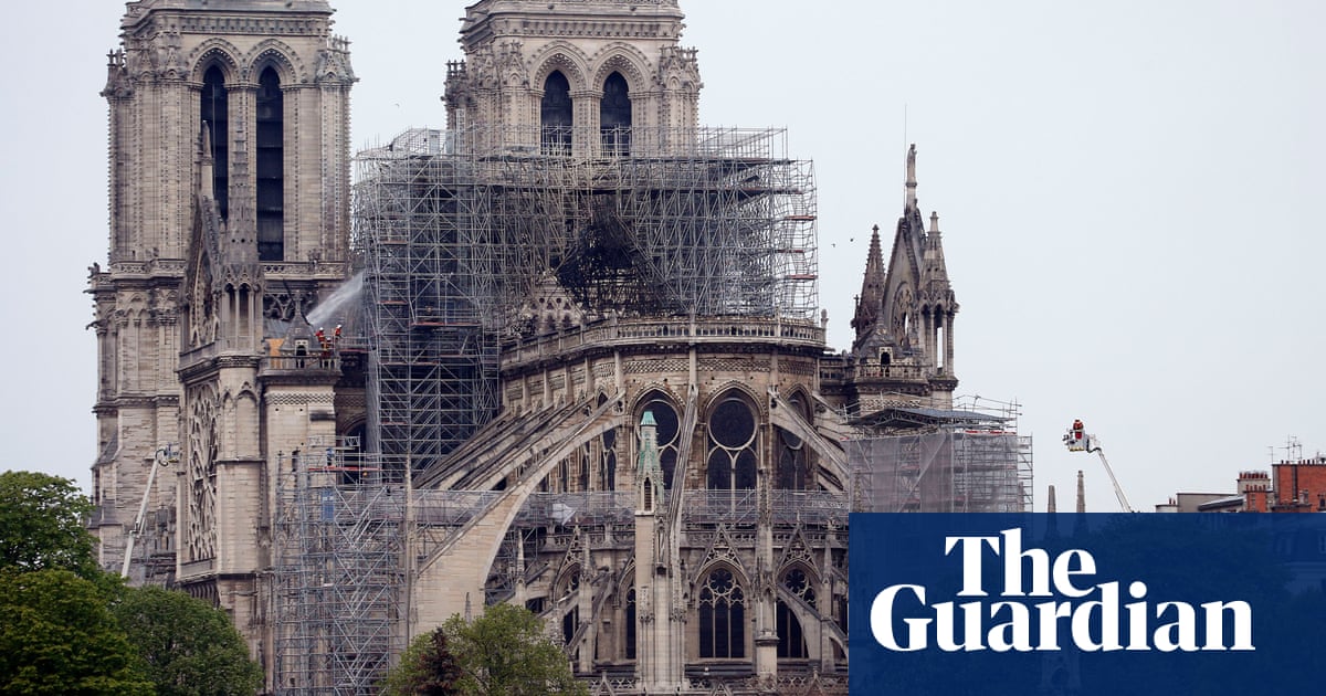 Notre Dame fire extinguished as investigators seek cause of blaze | World news