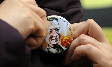 A woman wears a badge asking for the release of Liu Xiaobao outside the legislative council in Hong Kong, in 2010.